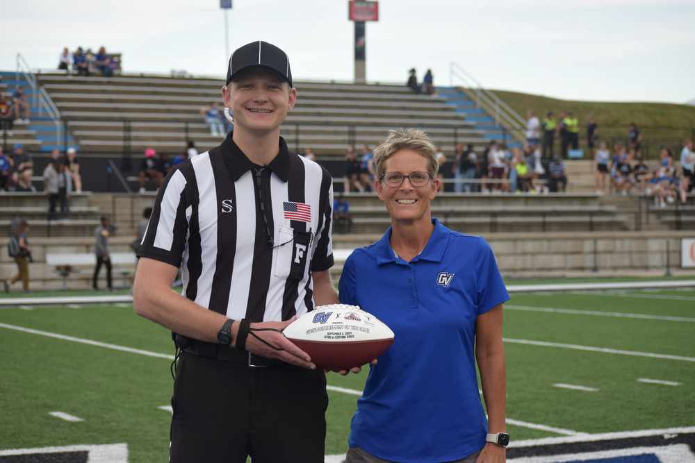 Dr. Heather Gulgin Hands Over the Game Ball
